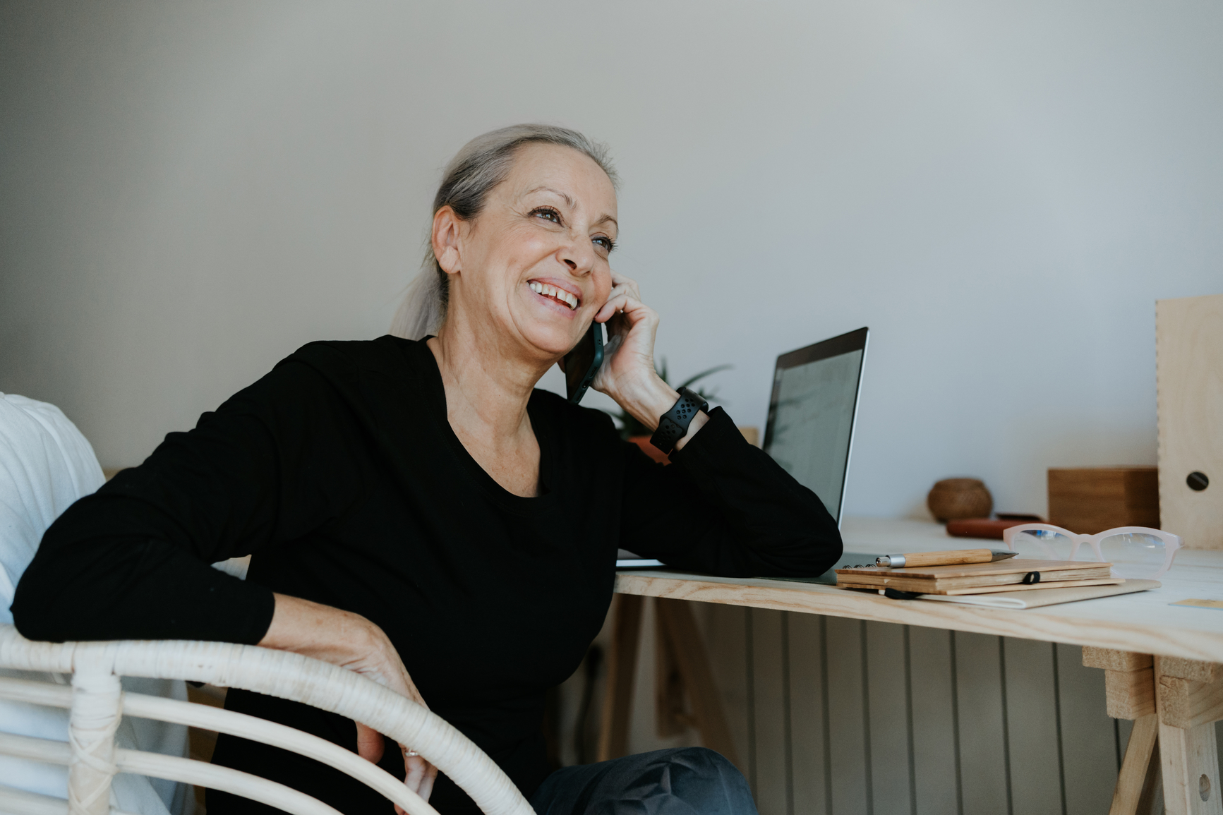 A calm moment with a phone and notes used to track appointments and next steps